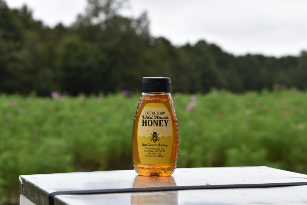 Bottle of local wildflower honey on table